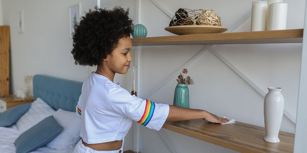 child helping clean at home