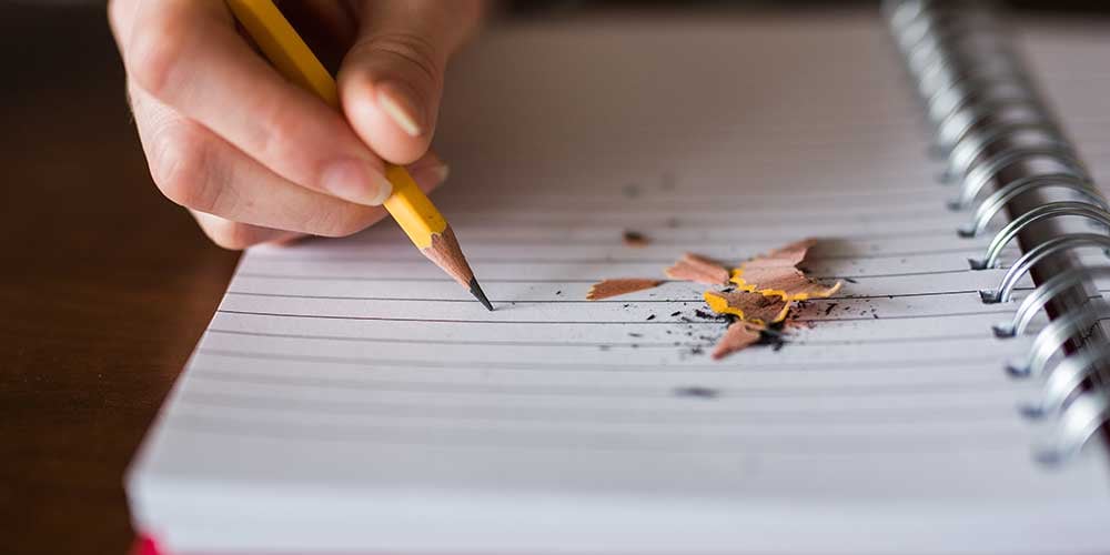 hand with pencil drawing a mind map