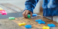 montessori activity child playing with playdough