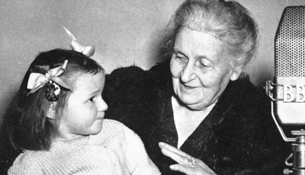 maria montessori with a child