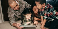 Kids using reading apps with parents