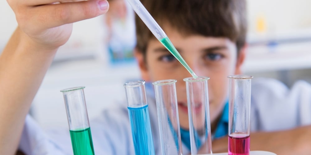 boy doing science experiment