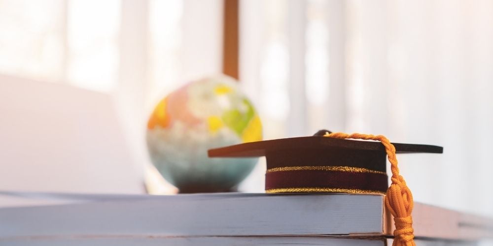 university cap on a table