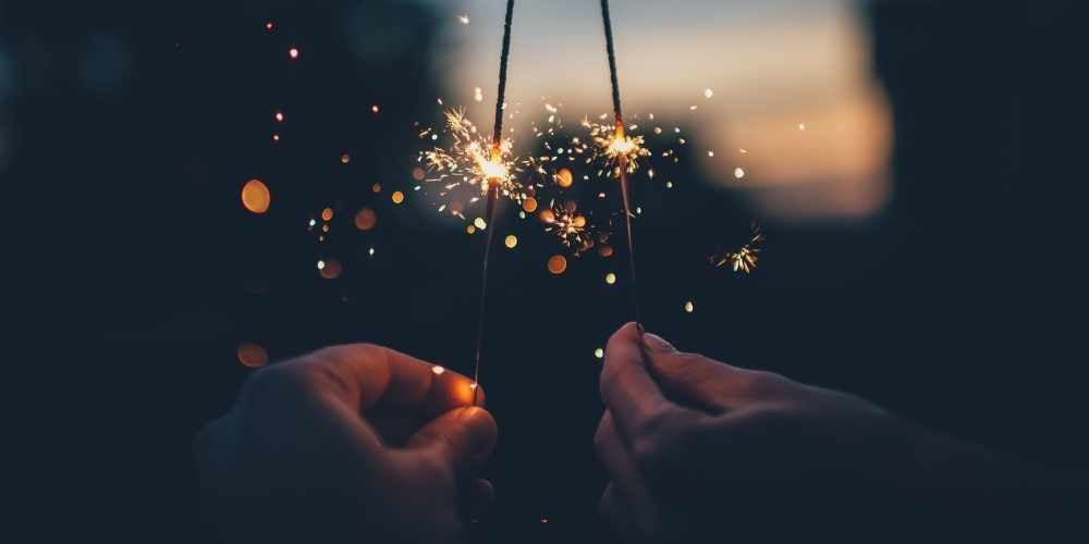 children holding sparklers on bonfire night