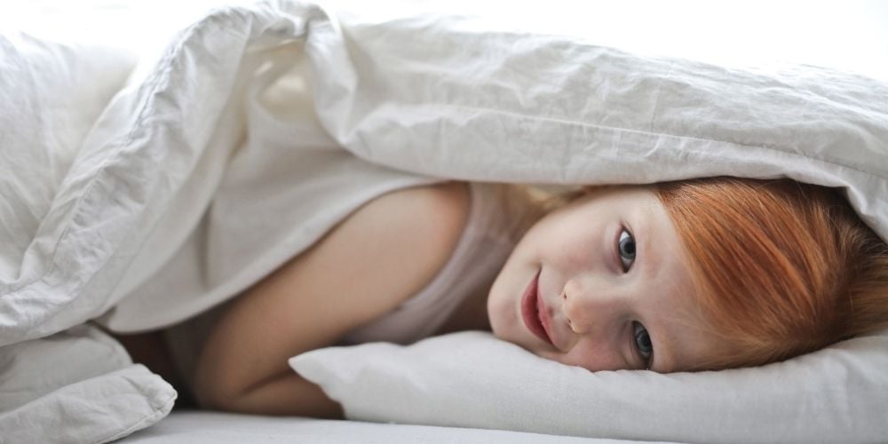 girl lying in bed