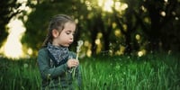 little girl in a forest school