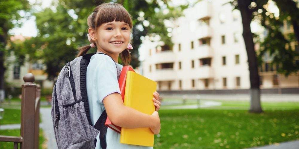 child wearing school bag
