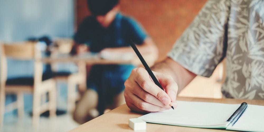 child taking an exam in school