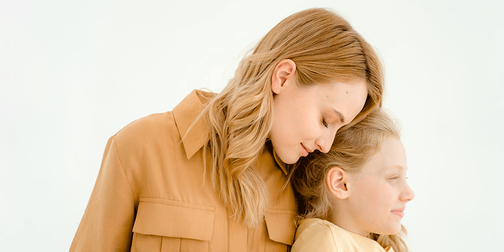 mother and daughter hugging