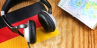 headphones listening to german podcast