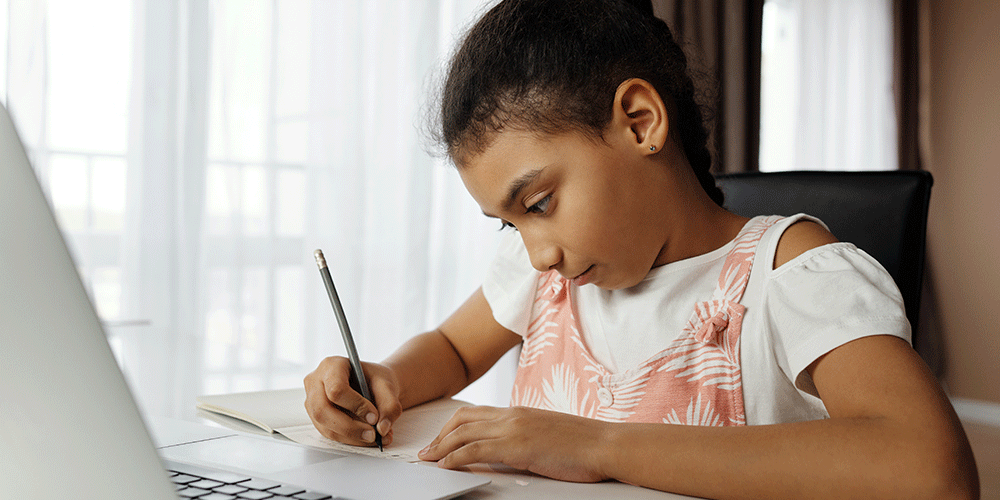 girl learning to write