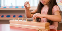 girl playing game in preschool