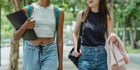 Two girls walking to university