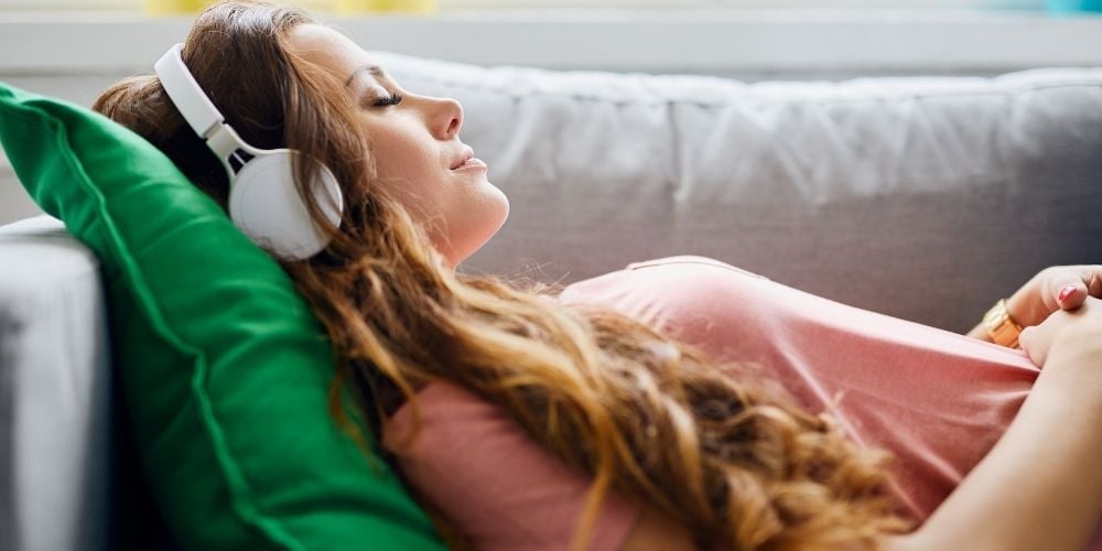 woman listening to podcast