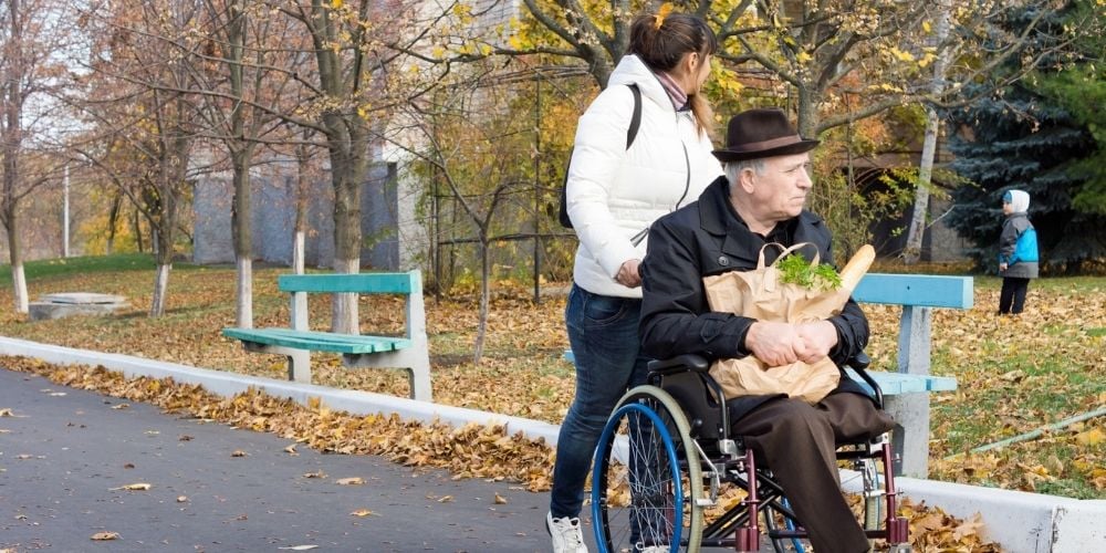 young carer with old man