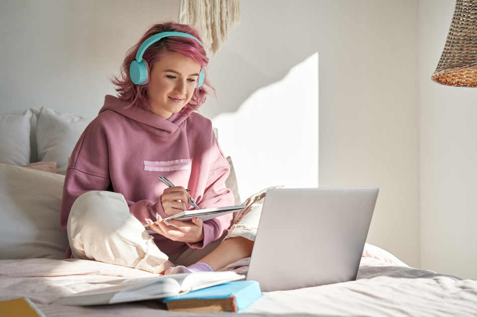 Girl on laptop listening to music