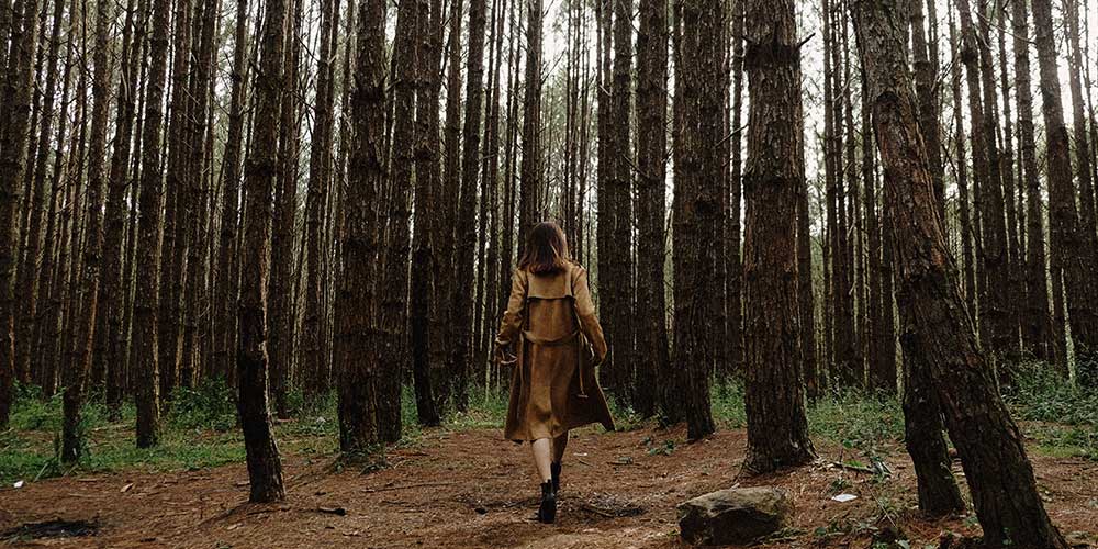 woman walking in the woods