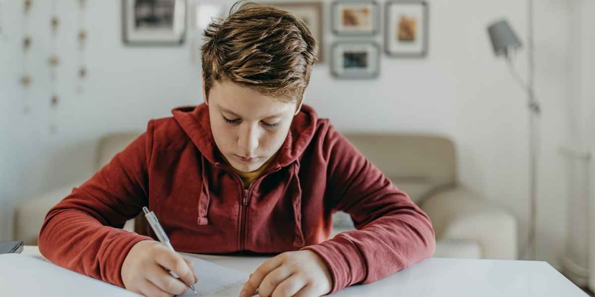 boy studying for highers at desk