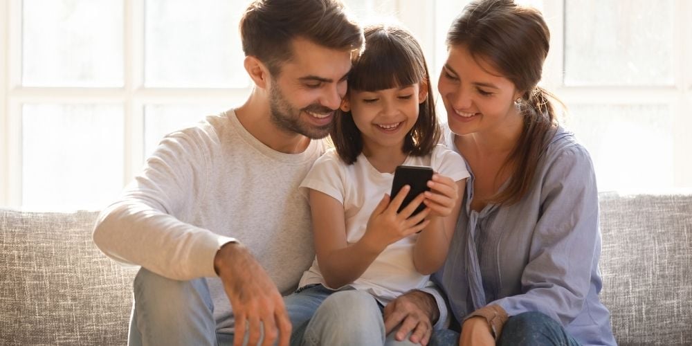 parents and child using an app