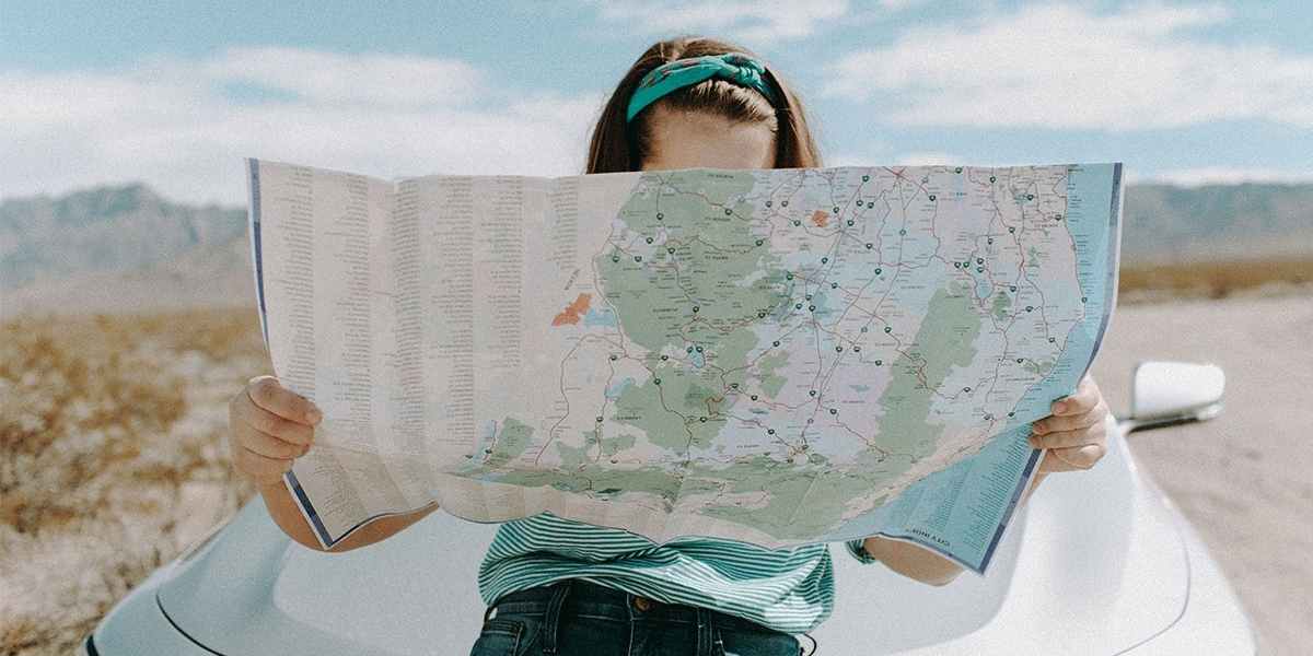 Girl looking at a map planning her gap year