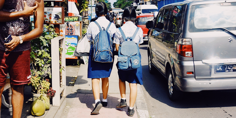 two girls going to boarding school in school uniform